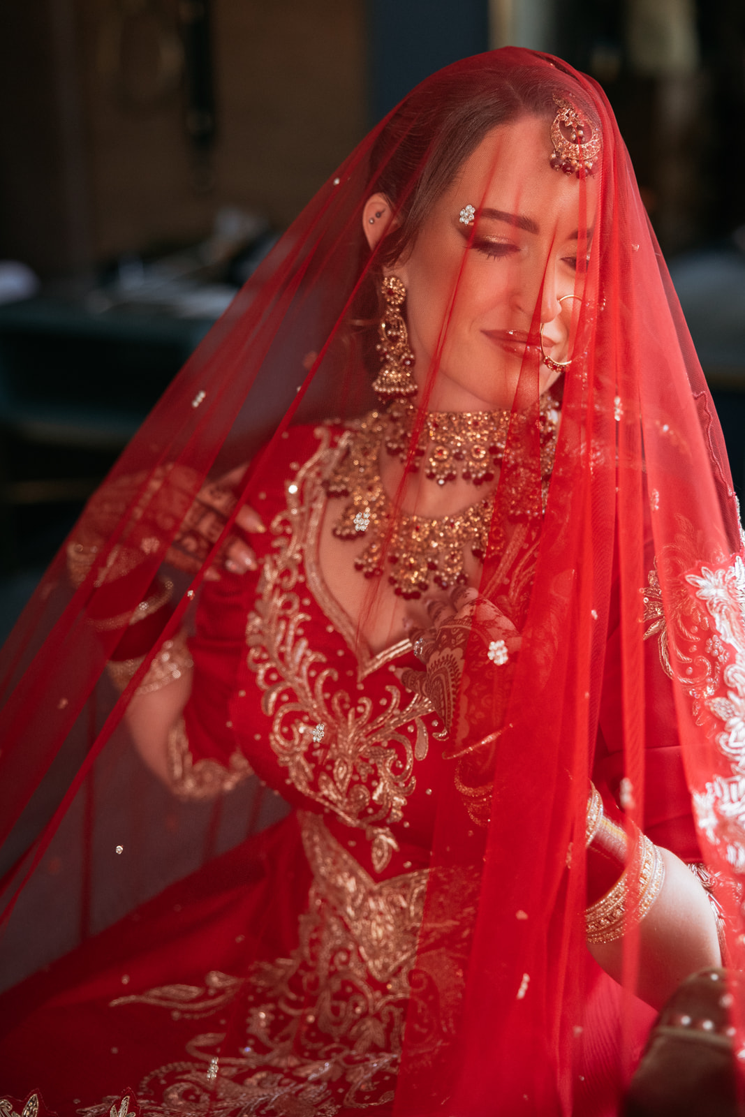 Lisa in traditional red bridal attire